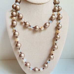 Cream crystal rondelles and matte taupe bead necklace on cord macrame bolo back